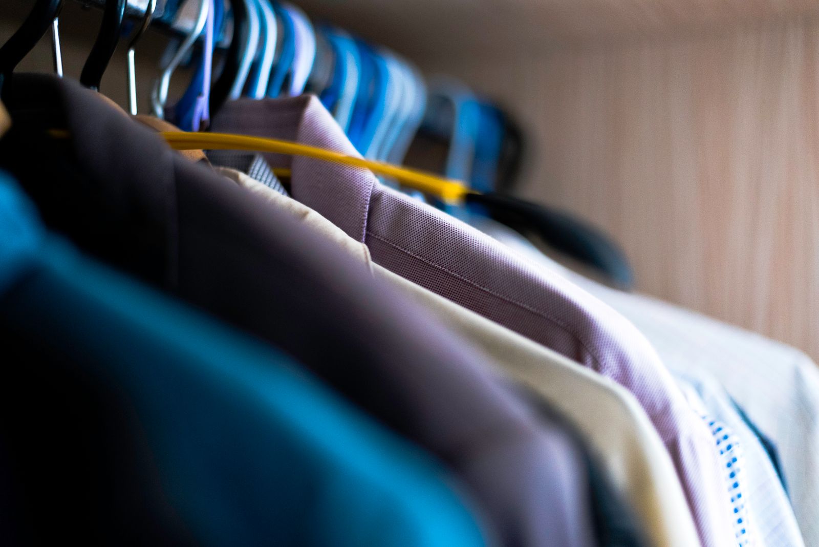 Colourful shirts on hangers at MCL — Miracle Cleaners Laundry